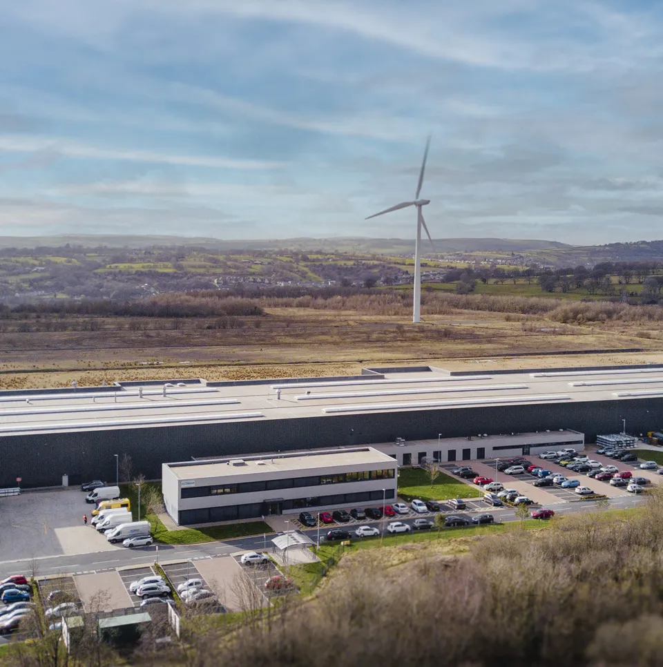 Aerial view of the IG Doors factory in Blackwood with a wind turbine behind