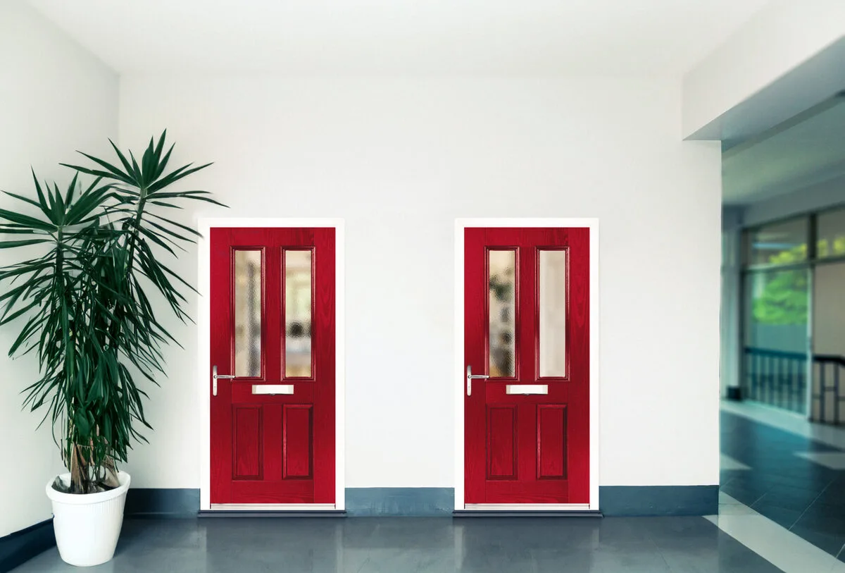 Two red composite doors in a hallway