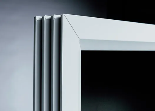 Corner detail of a white PVC door frame profile
