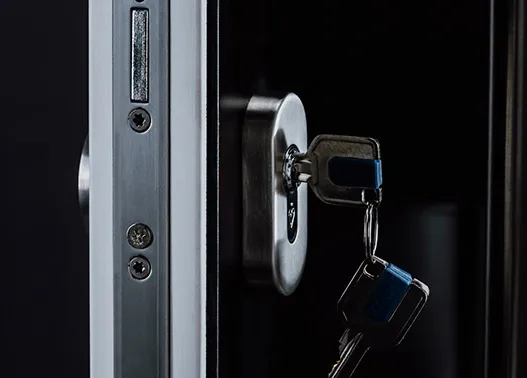 Security lock cylinder with keys beside the multi-point locking edge of a composite door